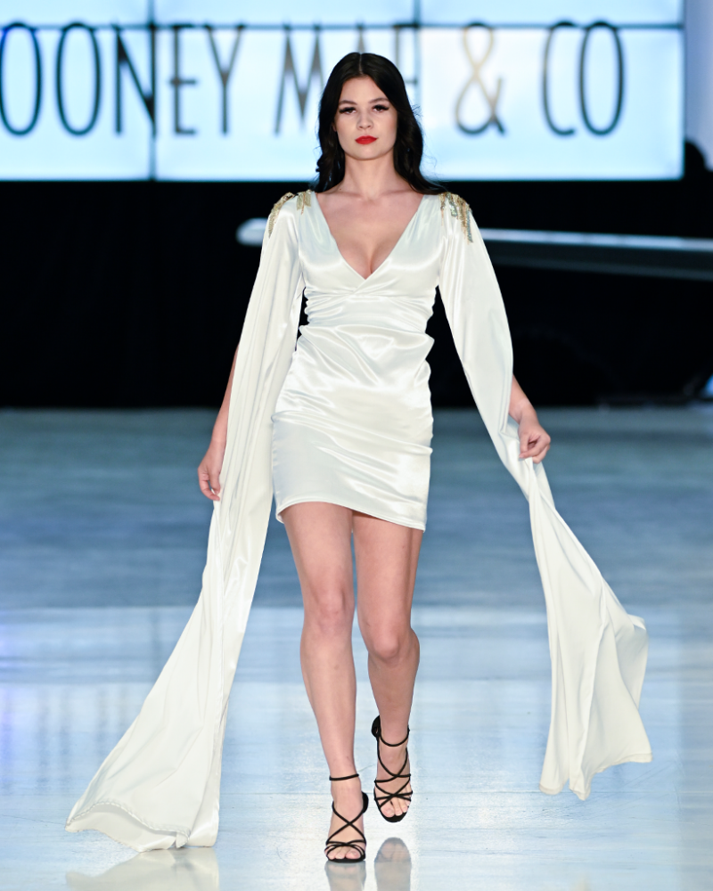 body-contour-dress-collection in white on model walking the cat walk